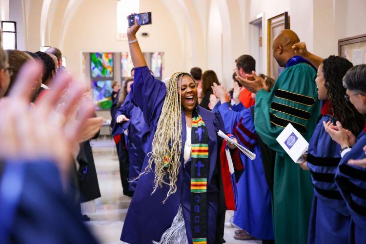Student cheering before 2025 graduation service