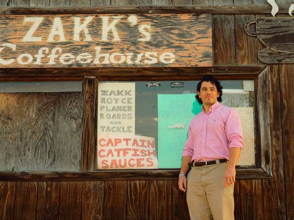 JASON VILLEGAS in from of a coffeehouse