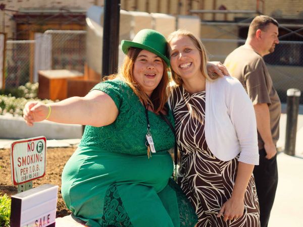 Laura Beach Byrch (right) with woman in green dress