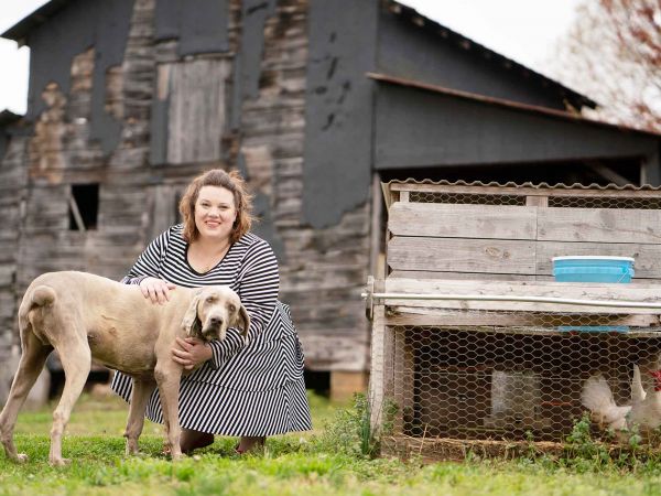 Rebekah Shuford Ralph, M.Div. ’14, with chickens and a dog