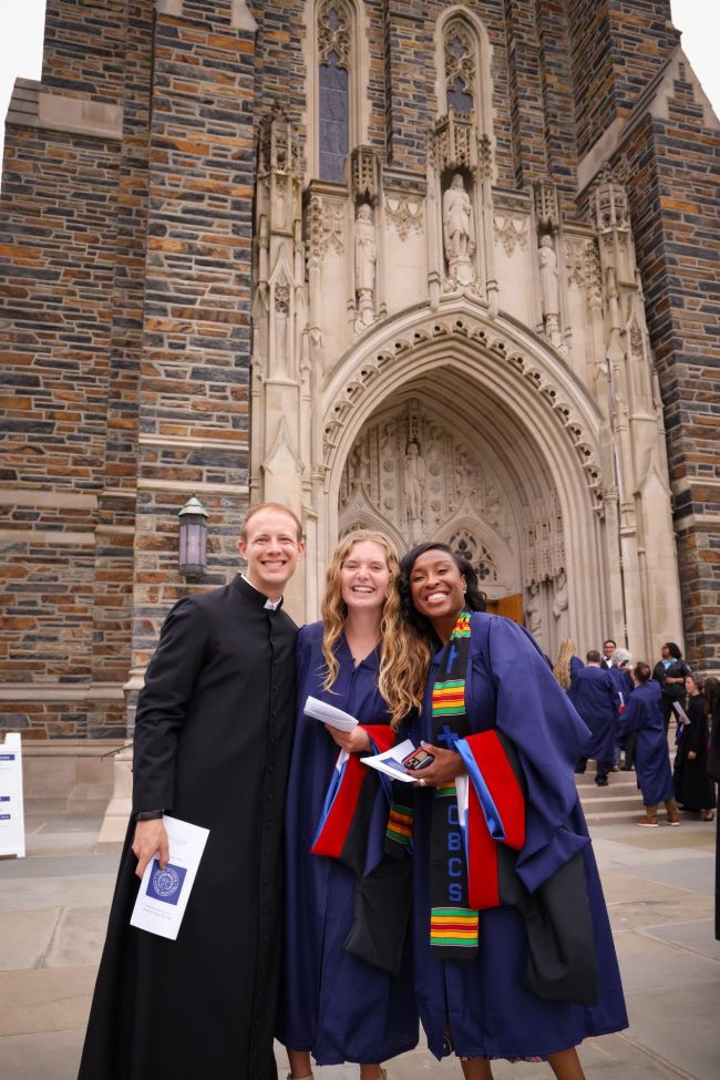 Students pose with hoods at the 2025 Baccalaureate Service