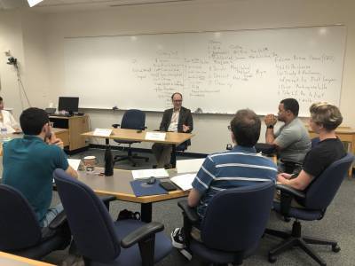 Divinity School Dean Edgardo Colón-Emeric talks with students in the seminar.