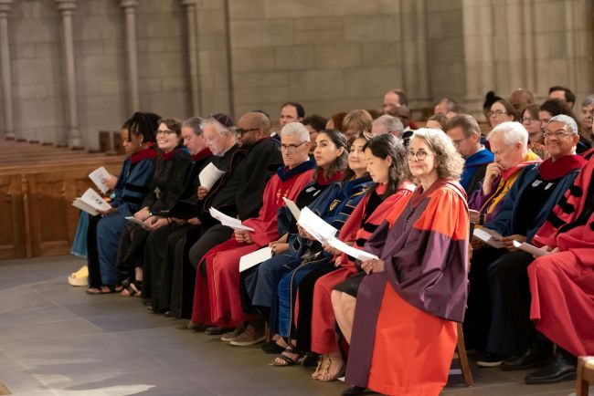 Faculty and staff sit in Duke Chapel in regalia during opening convocation