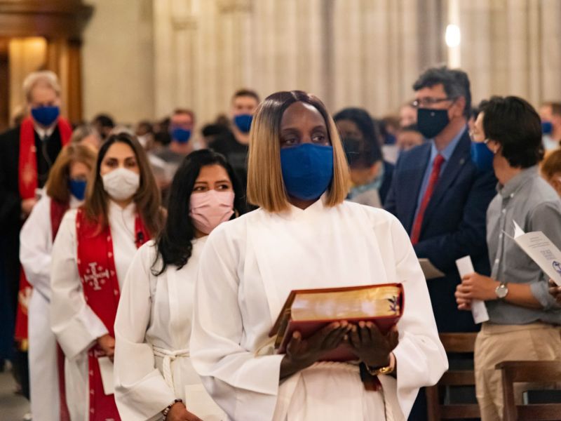 Student carries the bible into opening convocation at Duke Chapel