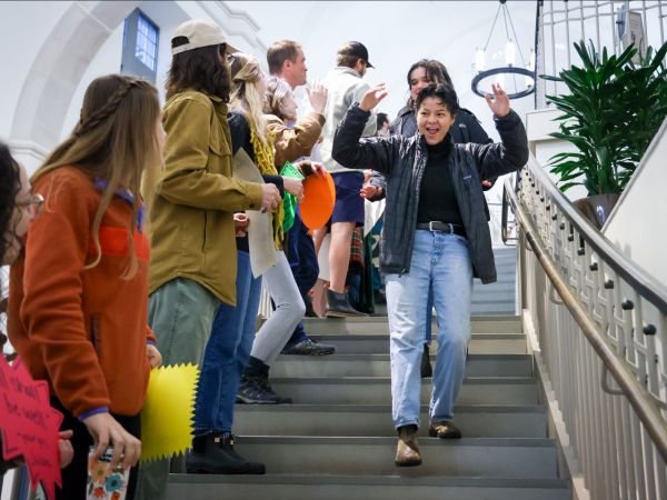 Jalen Garza walking down the steps cheering