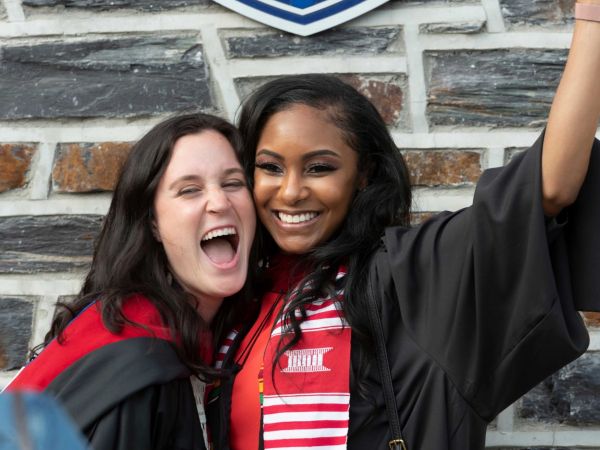 Meredith Rawls, M.Div./M.S.W.’21, and Amber Scott, M.Div.’21, celebrate at the graduation event.