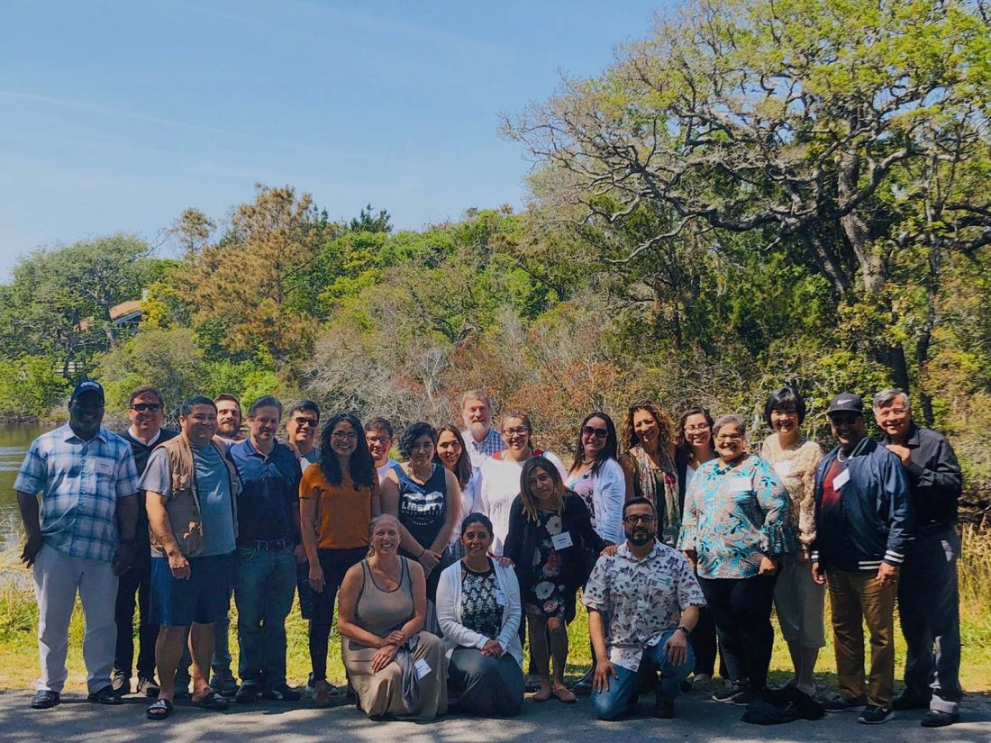 Participants pose outdoors