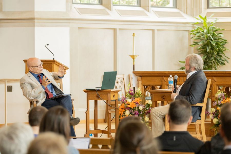 Man asking an animated question to speaker