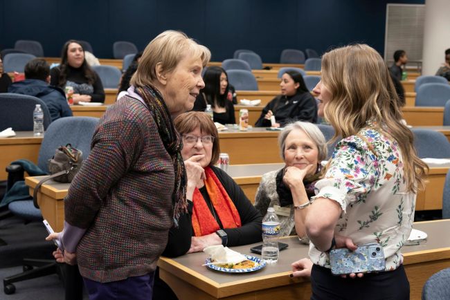 Women talk together at panel discussion