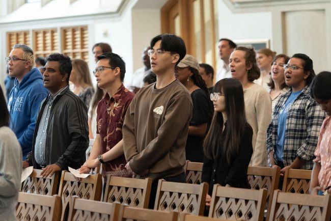 Students stand during service in Goodson