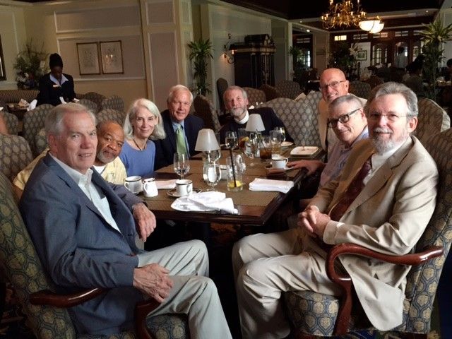 8 Divinity faculty around a dining table at the WaDuke. Looking at the camera are Lischer, Turner, Fulkerson, Willimon, Smith, Gunter, Wacker and Hays