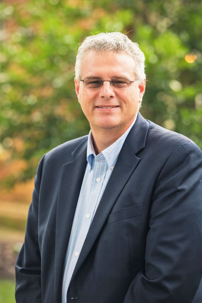 Dale Coulter, white man with glasses and white hair in blue sport coat and light blue shirt