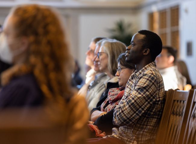 Students watch lecture in Goodson Chapel