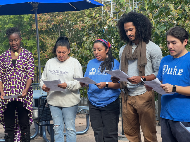 Students, faculty, and staff gather on the terrace for prayer
