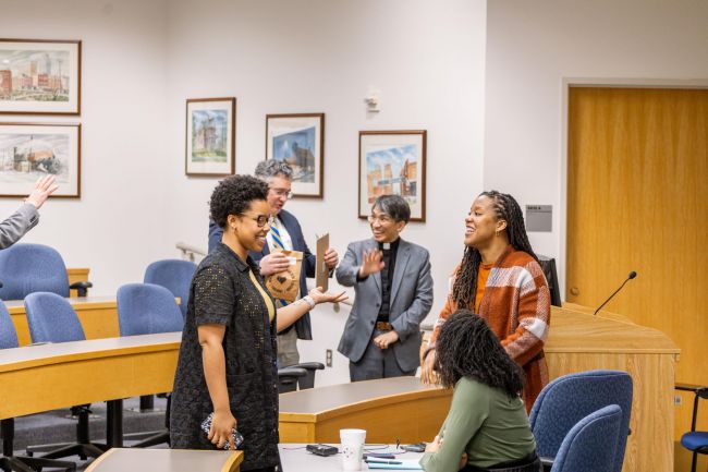Students, faculty, and staff talk together after a Pan-Methodism panel discussion