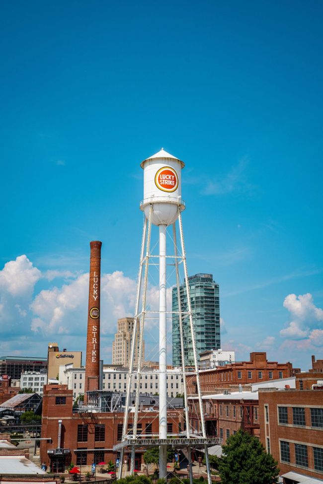 Durham skyline shows Lucky Strike tower at American Tobacco Campus