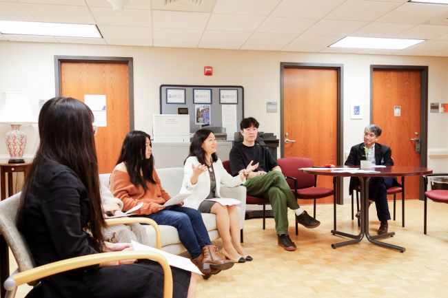 Asian House members chat during a meeting