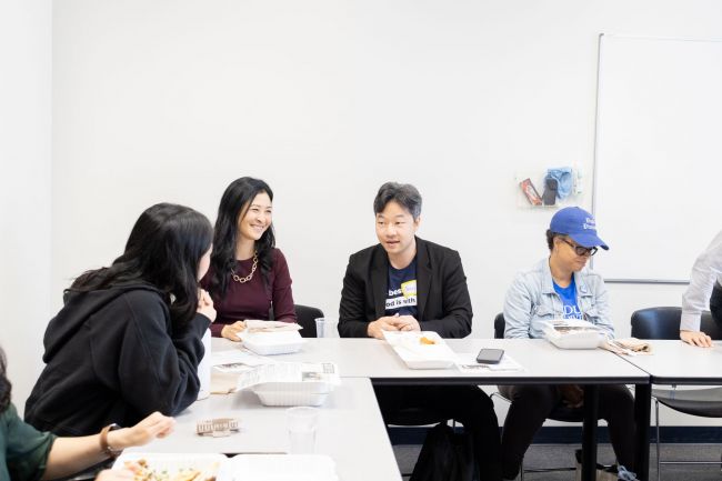 Members of Asian House talk during lunch