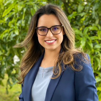 Alissa Arango wearing a blazer and glasses