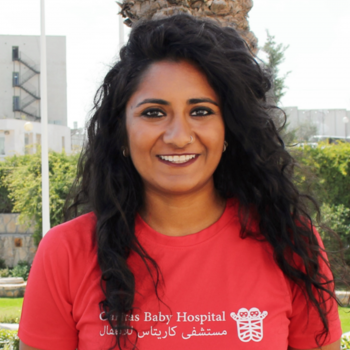 Bindu Thota smiling and wearing a red shirt