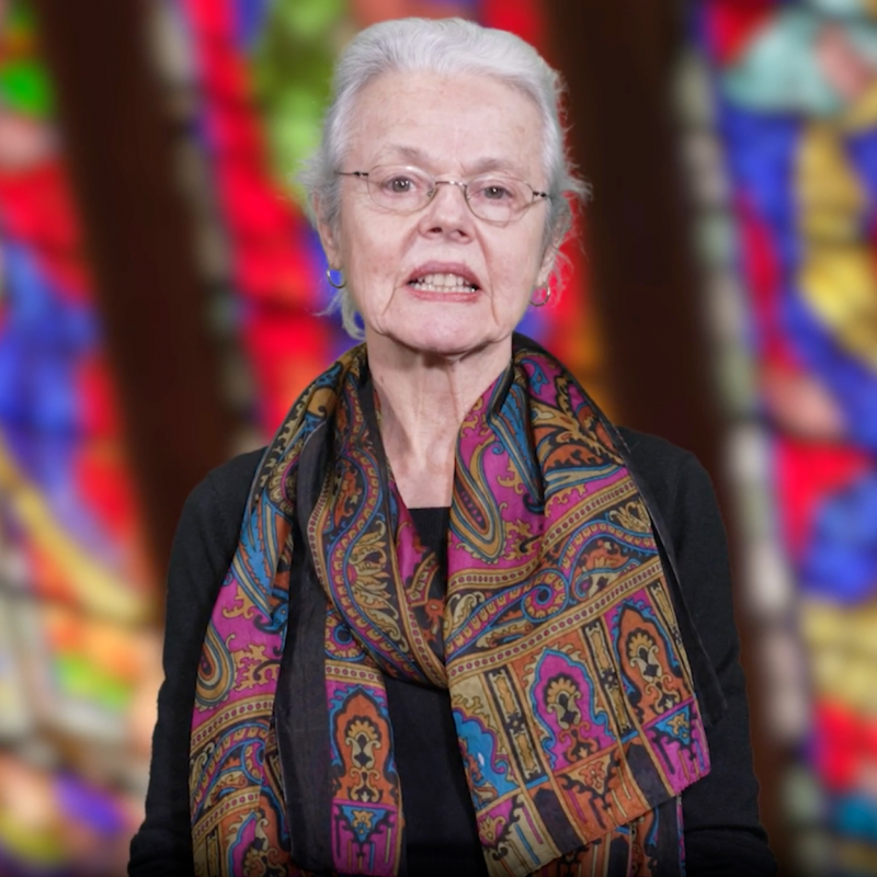 Ellen Davis in front of stained glass window