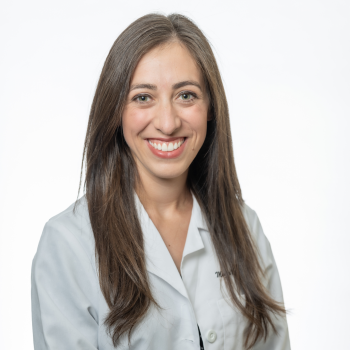 Maglin Halsey-Nichols smiling and wearing a white coat