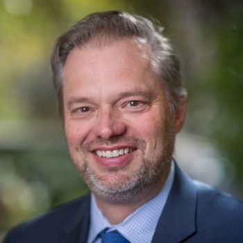 Don Taylor wearing a blue blazer