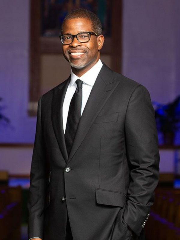 Prince Raney Rivers headshot in suit in church